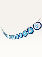 Paper Party Studio Om Namah Shivaya blue cardstock bunting with scalloped medallions and trishul accents for pooja.