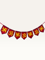 Paper Party Studio red and yellow paper pennant banner featuring traditional Om and Swastik motifs for Diwali decor