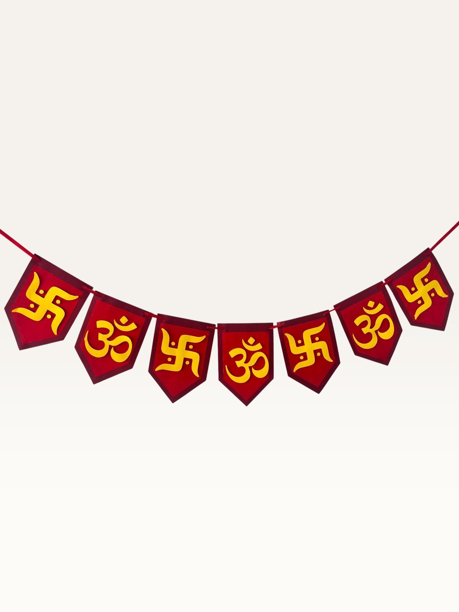 Paper Party Studio red and yellow paper pennant banner featuring traditional Om and Swastik motifs for Diwali decor