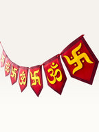 Paper Party Studio red and yellow cardstock bunting with Om and Swastik symbols for Diwali and festive home decor.