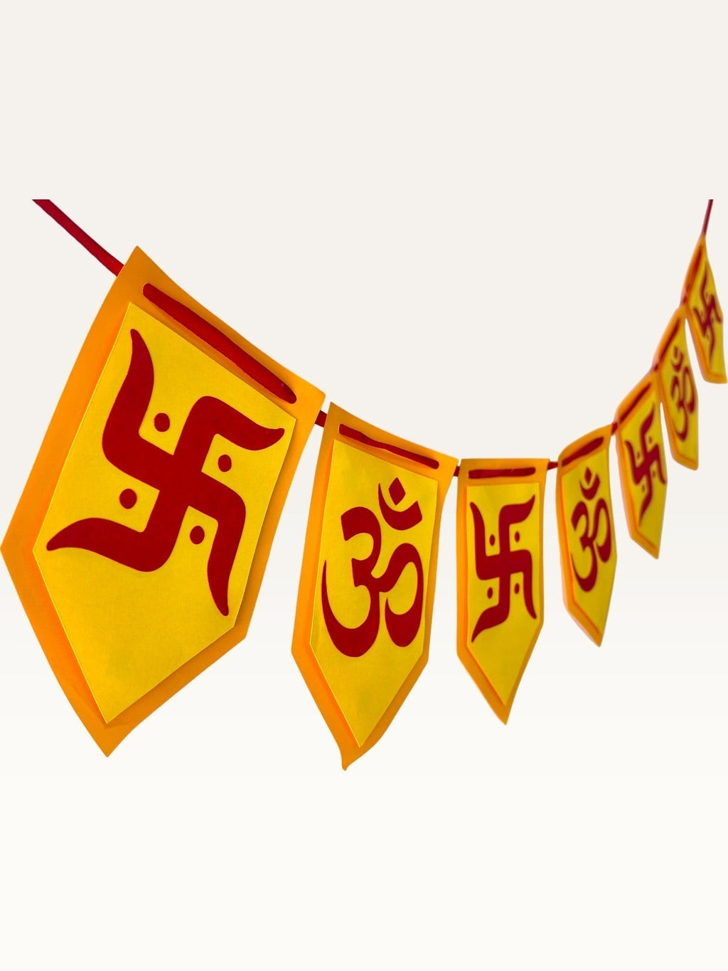 Paper Party Studio yellow and red cardstock bunting with Om and Swastik symbols for festive home decoration.