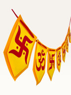 Paper Party Studio yellow and red cardstock bunting with Om and Swastik symbols for Diwali and festive home decor.