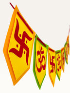 Paper Party Studio Om and Swastik bunting with yellow pentagon flags featuring red sacred symbols for festive decor.