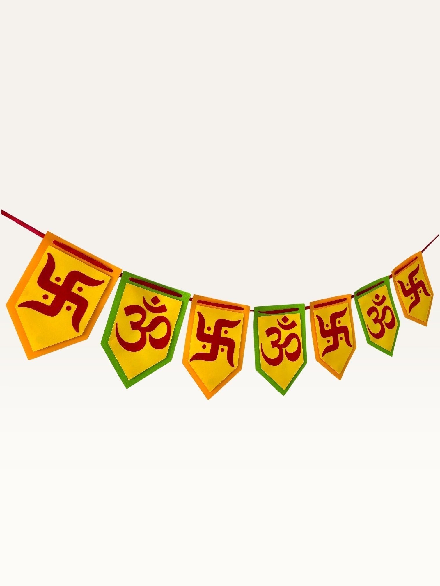 Paper Party Studio Om and Swastik bunting with yellow and green pentagon flags for festive home decoration.