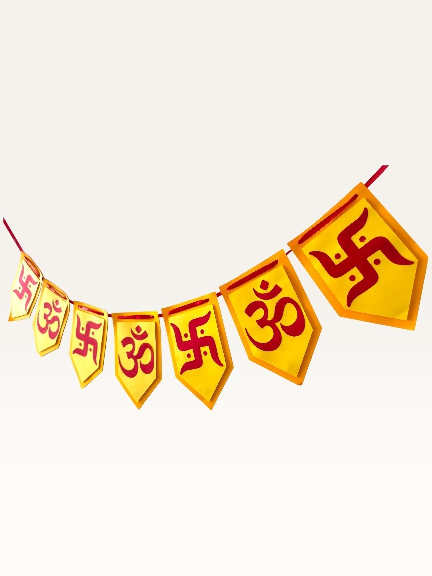 Paper Party Studio yellow and red cardstock bunting with Om and Swastik symbols for festive home decoration.