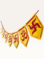 Paper Party Studio Om and Swastik bunting with yellow pentagon flags and red symbols for festive home decoration.