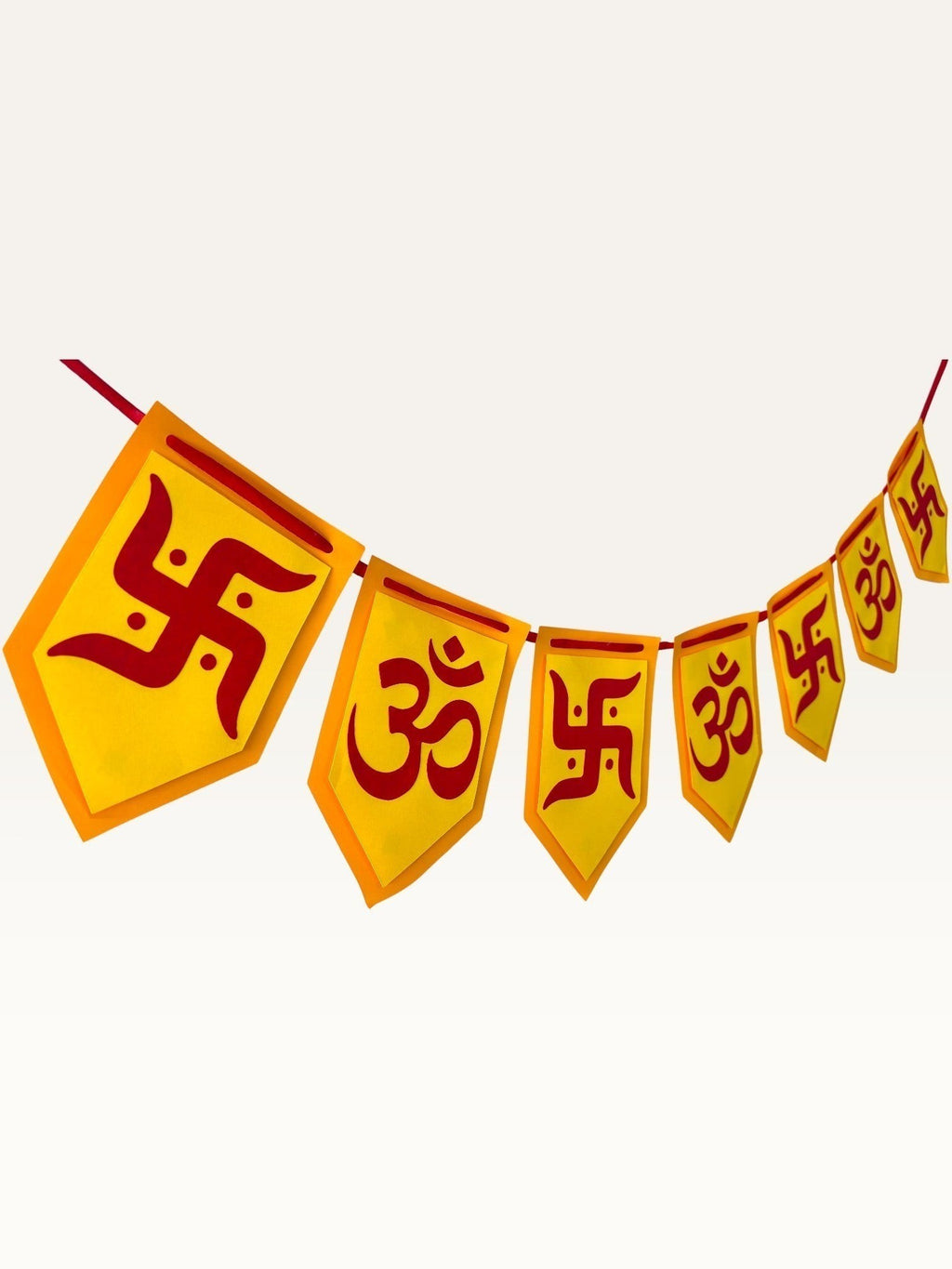 Paper Party Studio yellow and red cardstock bunting with Om and Swastik symbols for Diwali and festive home decor.