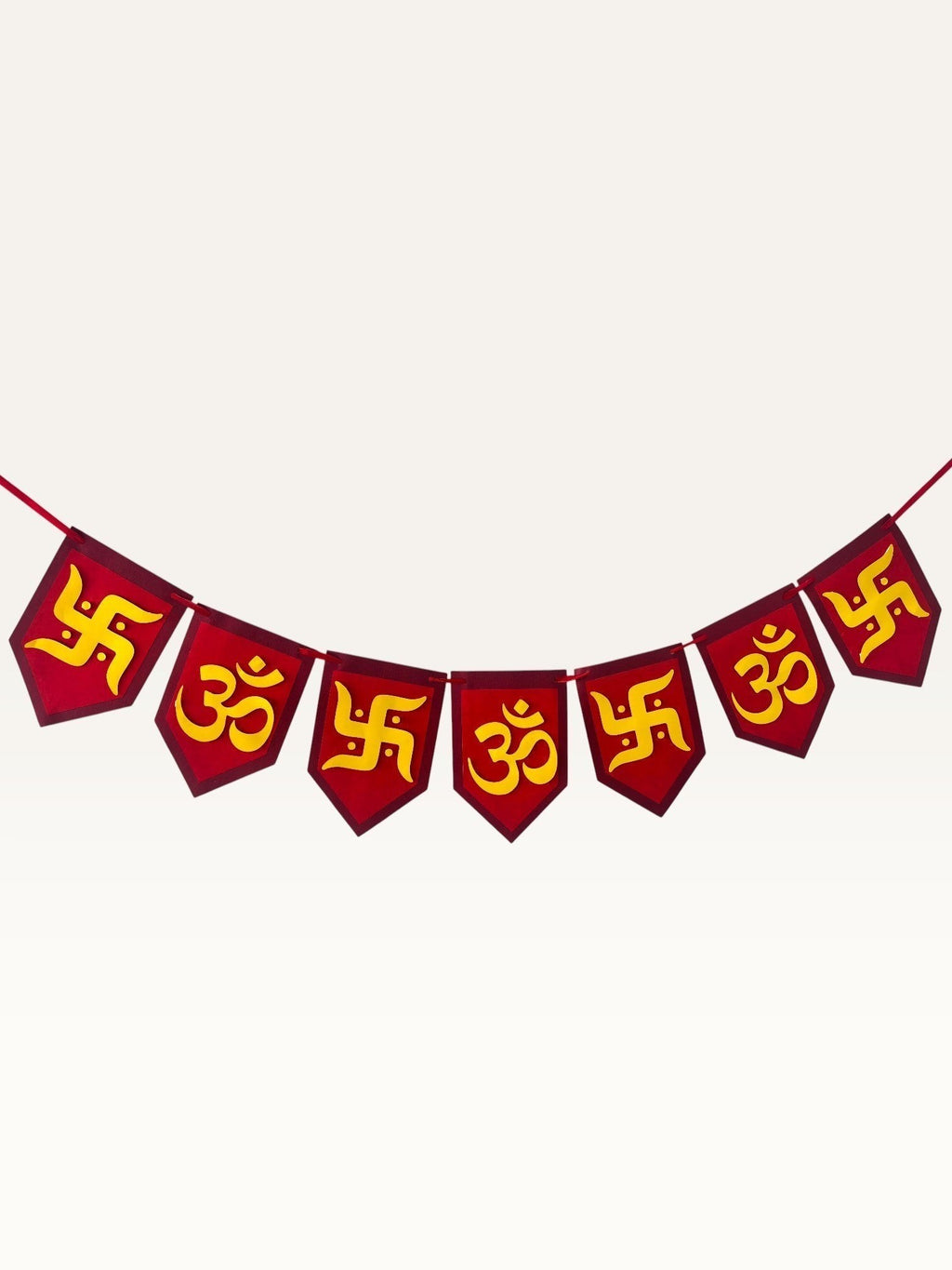 Paper Party Studio Om and Swastik bunting with red and yellow pentagon flags for festive home decoration.