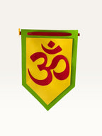 Paper Party Studio Om symbol bunting flag made of layered yellow and green cardstock for festive home decoration.