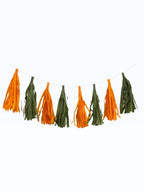 Paper Party Studio handmade tissue paper tassel garland in alternating orange and green for party decor.