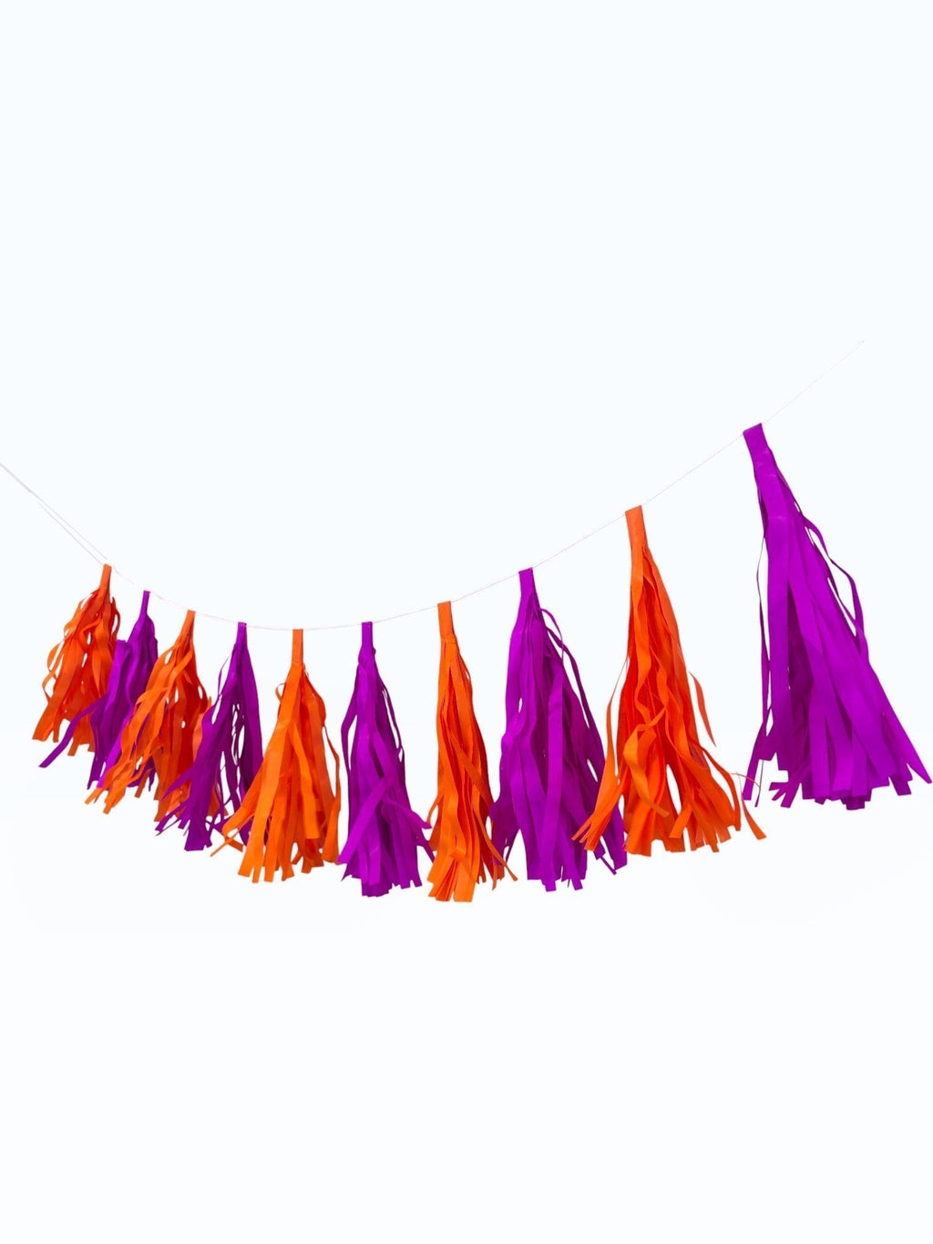 Paper Party Studio orange and purple tissue paper tassel garland for party decorations and photo backdrops.