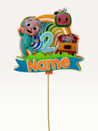 Paper Party Studio personalised sing-along birthday cake topper with layered cardstock rainbow, bus, and character.