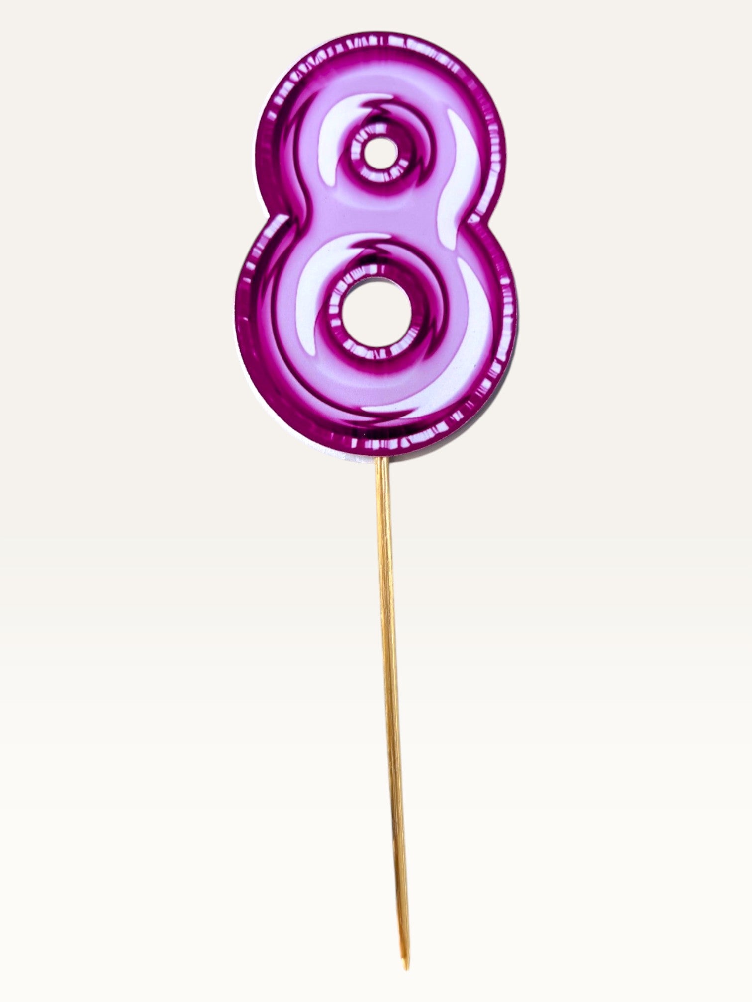 Paper Party Studio pink foil number eight cupcake topper on a bamboo stick with a glossy double-sided finish.