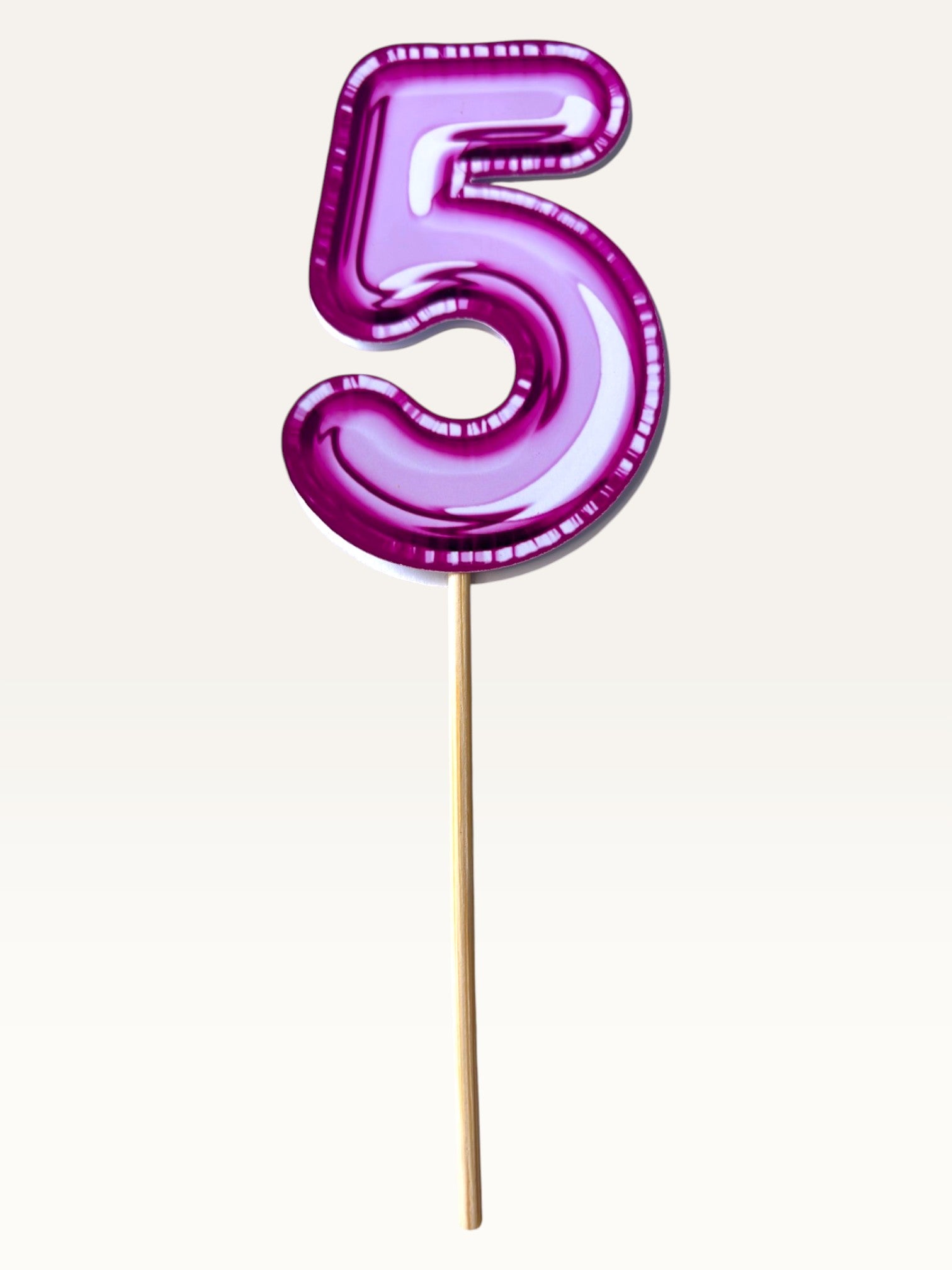 Paper Party Studio glossy pink foil number 5 cake topper on a bamboo stick for birthday celebrations.