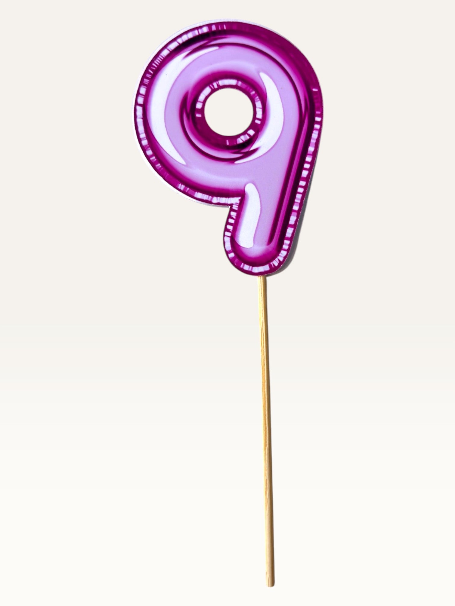 Paper Party Studio pink foil number 9 cupcake topper on a bamboo stick with a glossy double-sided finish.