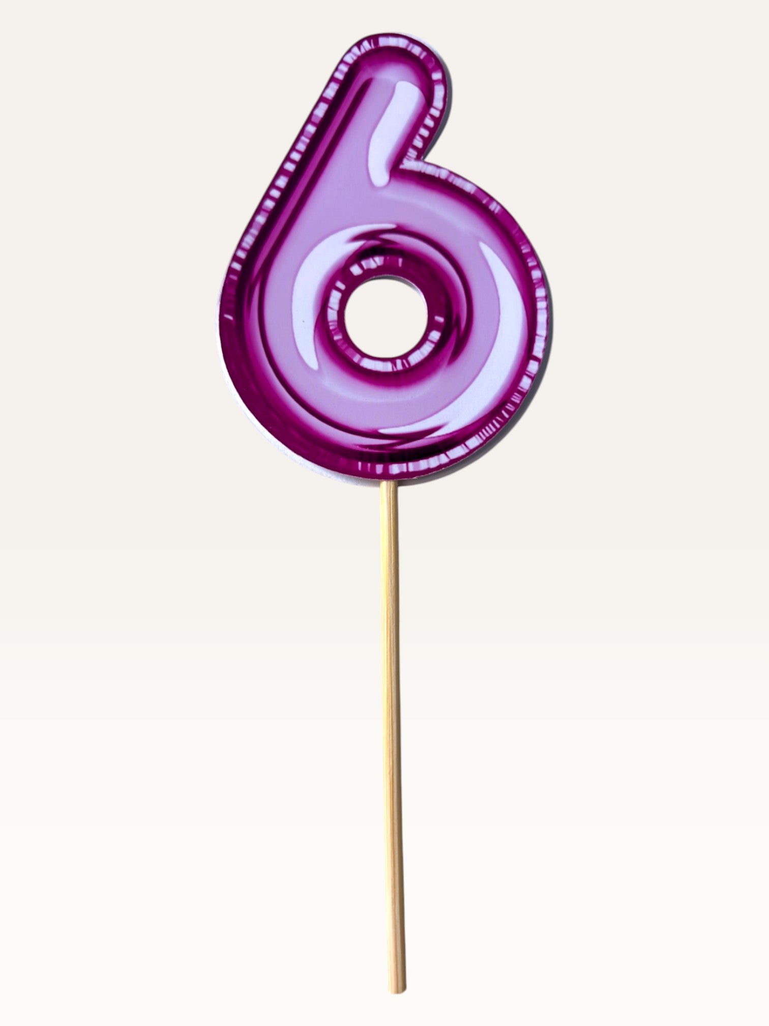 Paper Party Studio pink foil number six cupcake topper on a bamboo stick with a glossy metallic finish