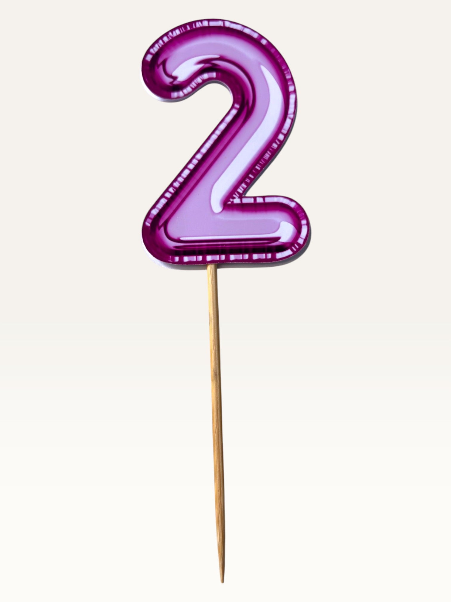 Paper Party Studio pink foil number two cupcake topper on a bamboo stick with glossy double-sided finish