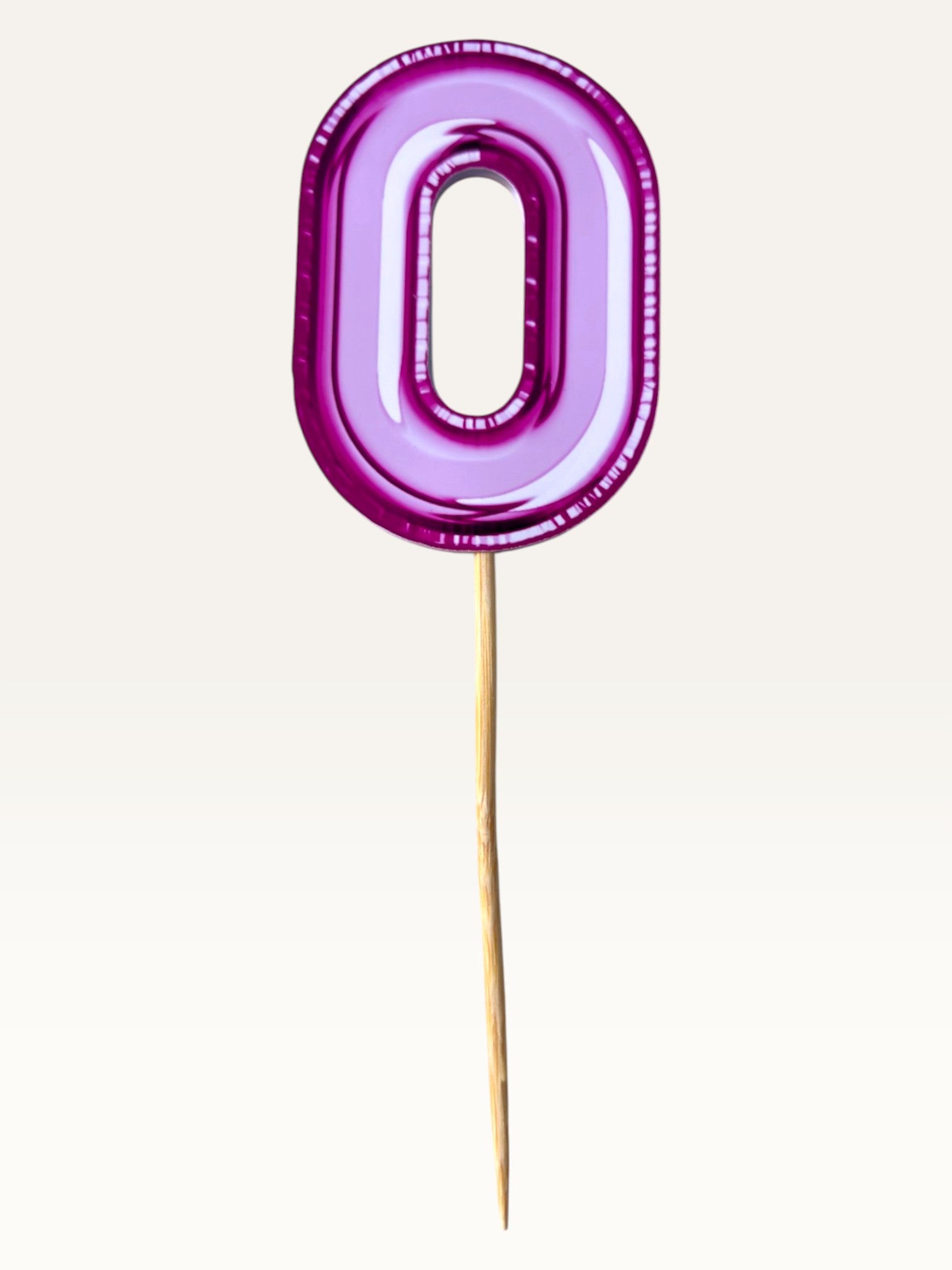 Paper Party Studio glossy pink foil number zero cake topper on a bamboo stick for birthday celebrations.