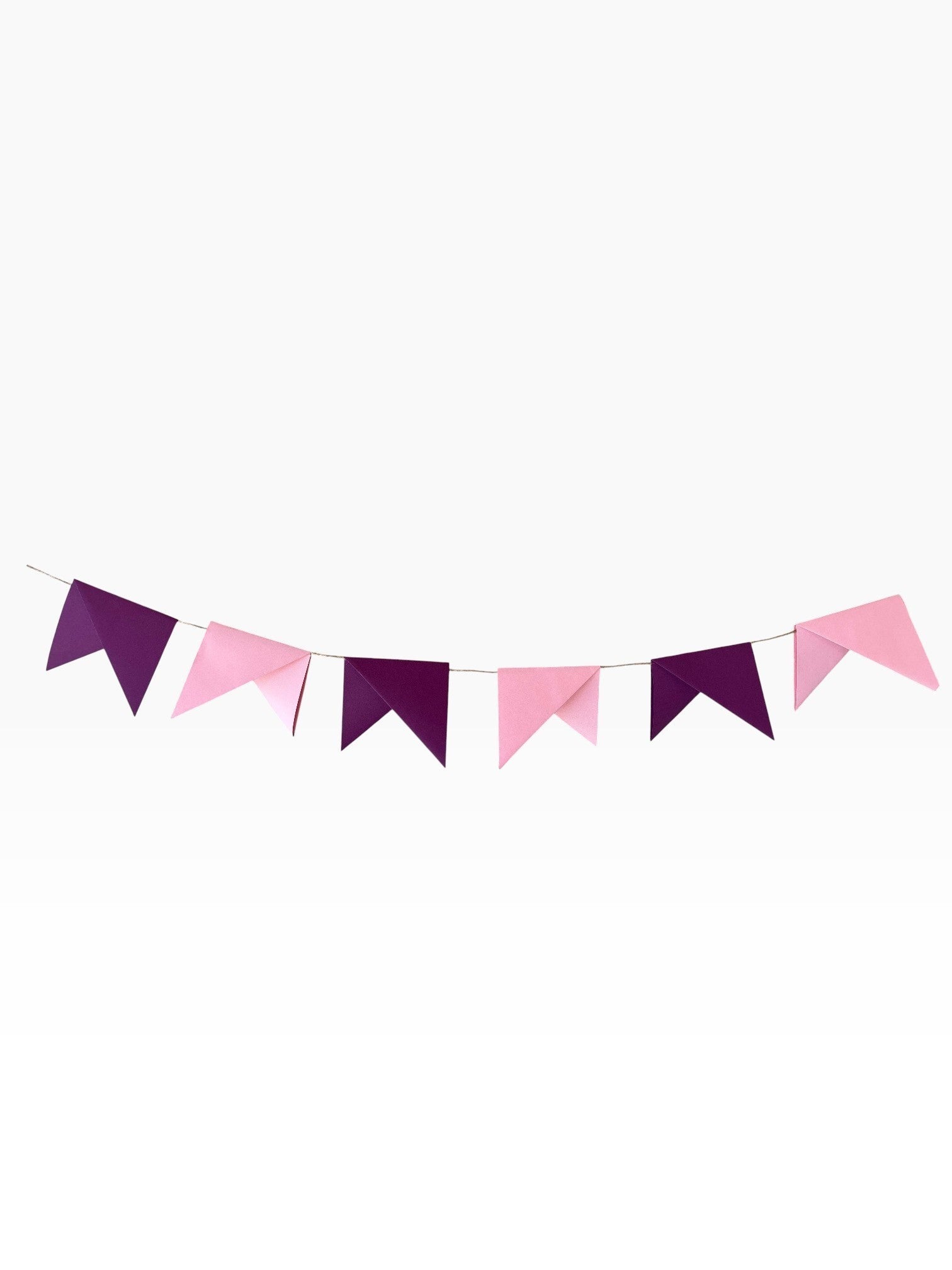 Paper Party Studio handmade paper bunting with alternating soft pink and deep purple pennant flags for celebrations.