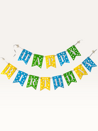 Paper Party Studio Happy Birthday banner with blue, green, and yellow polka dot swallowtail flags and white letters.