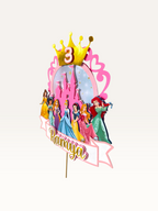 Paper Party Studio personalised princess castle cake topper with gold crown, age 3, and Disney princess characters.