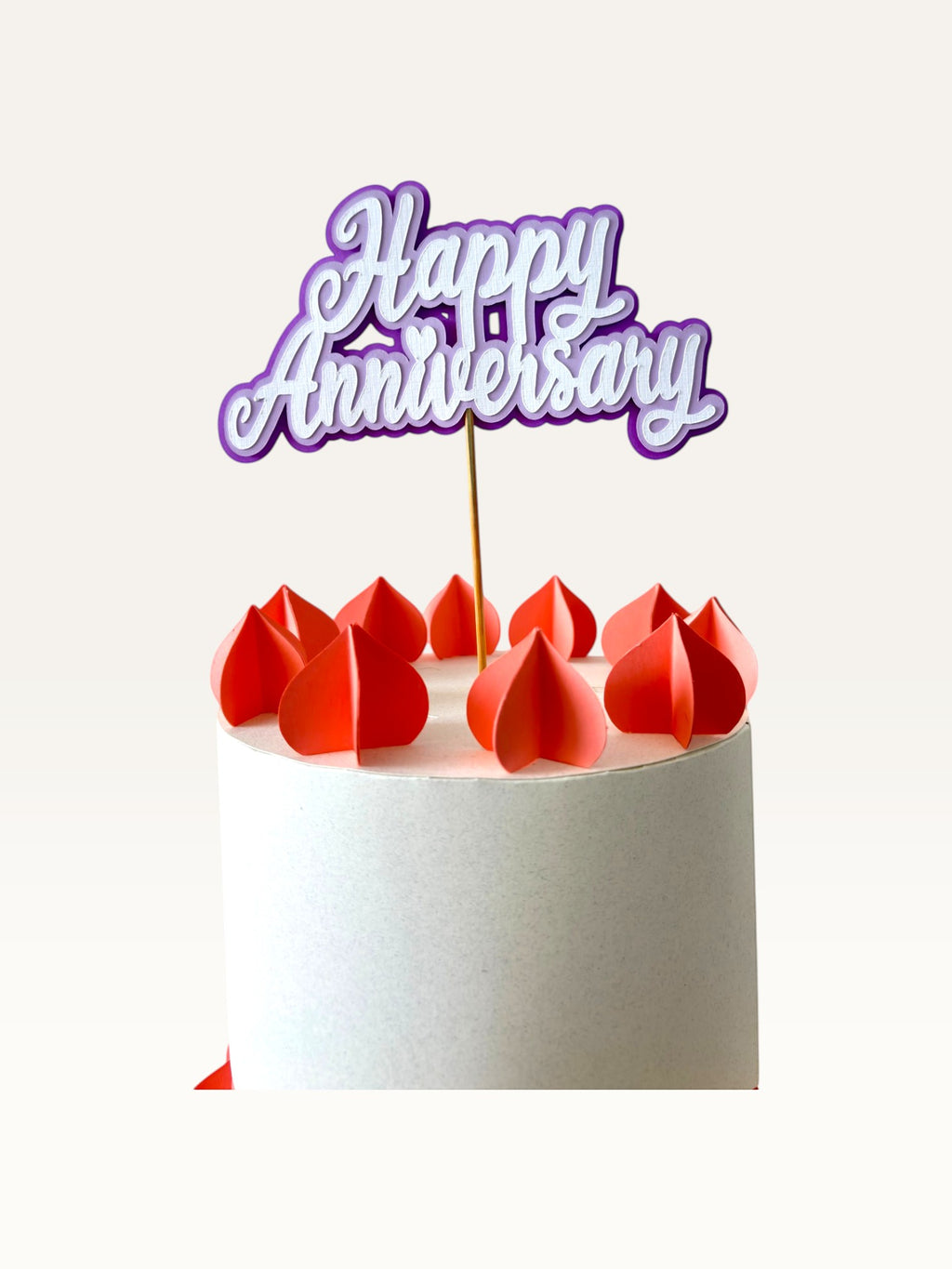 Paper Party Studio purple layered script Happy Anniversary cake topper with heart detail on a white cake