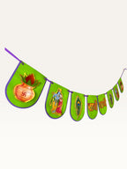 Paper Party Studio Radhe Radhe paper banner with green flags, purple edges, and gold Radha-Krishna festive motifs.
