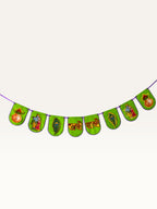 Paper Party Studio green paper banner for Janmashtami featuring Radha-Krishna, peacock feathers, and gold lettering.