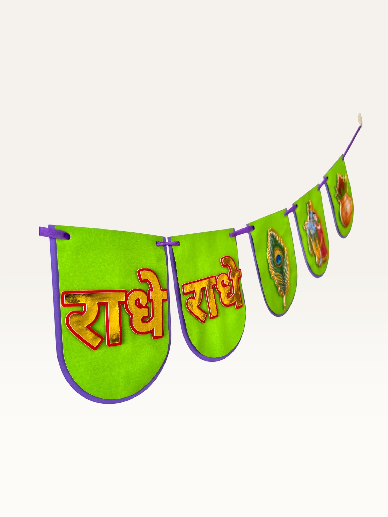 Paper Party Studio green paper banner for Janmashtami with gold Radha-Krishna, peacock feather, and Radhe Radhe text.