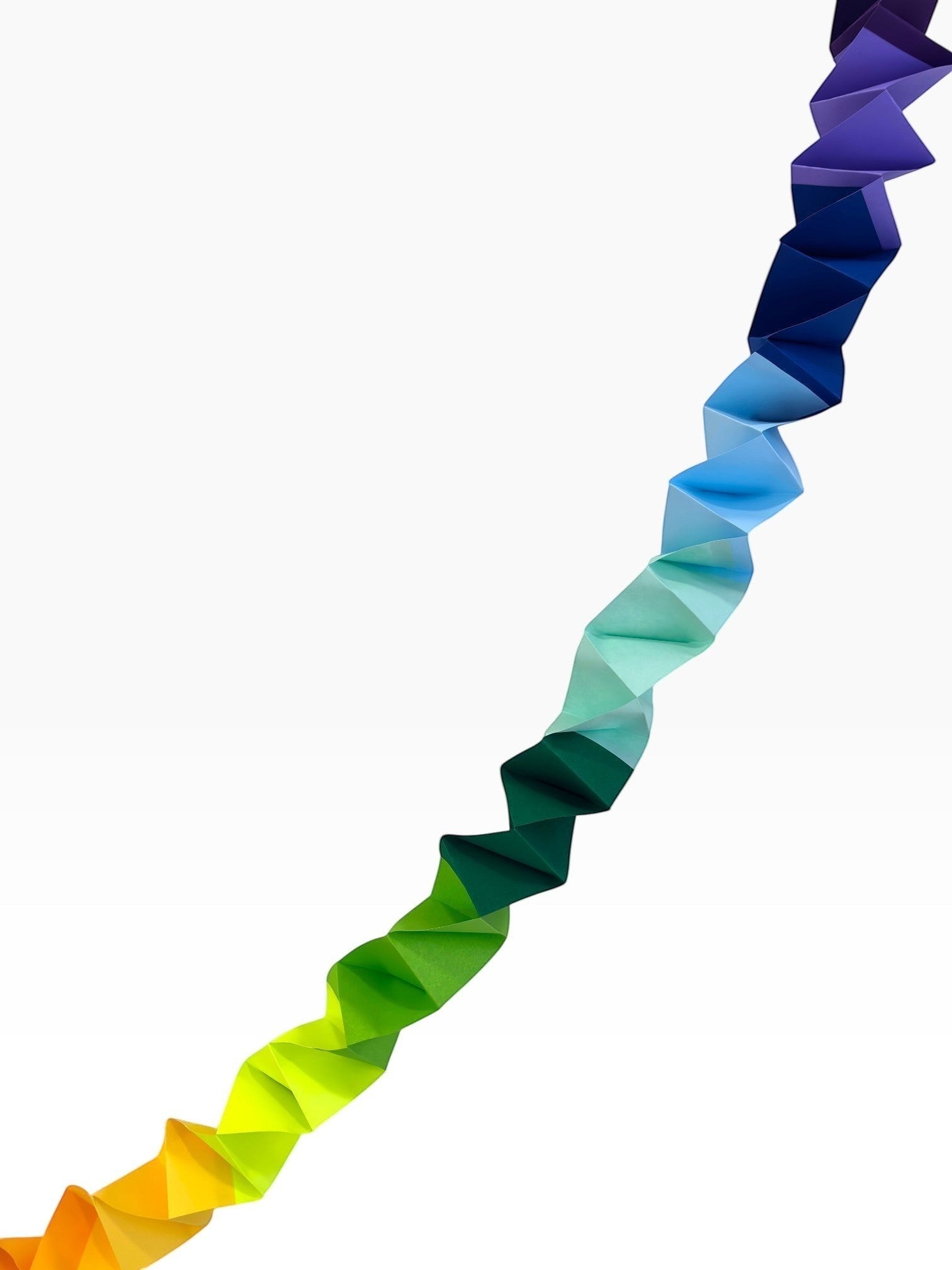Paper Party Studio rainbow accordion streamer garland made of folded cardstock, adds movement and colour.
