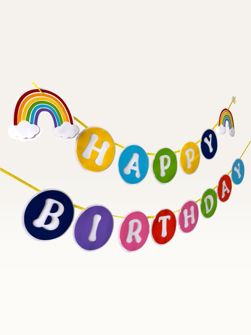 Paper Party Studio rainbow Happy Birthday banner with colourful paper circles and cloud accents for kids parties.