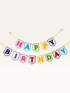 Paper Party Studio rainbow Happy Birthday banner with scalloped white paper flags on a bright yellow cord.