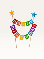 Paper Party Studio rainbow Happy Birthday bunting cake topper with foil star-tipped wooden picks.
