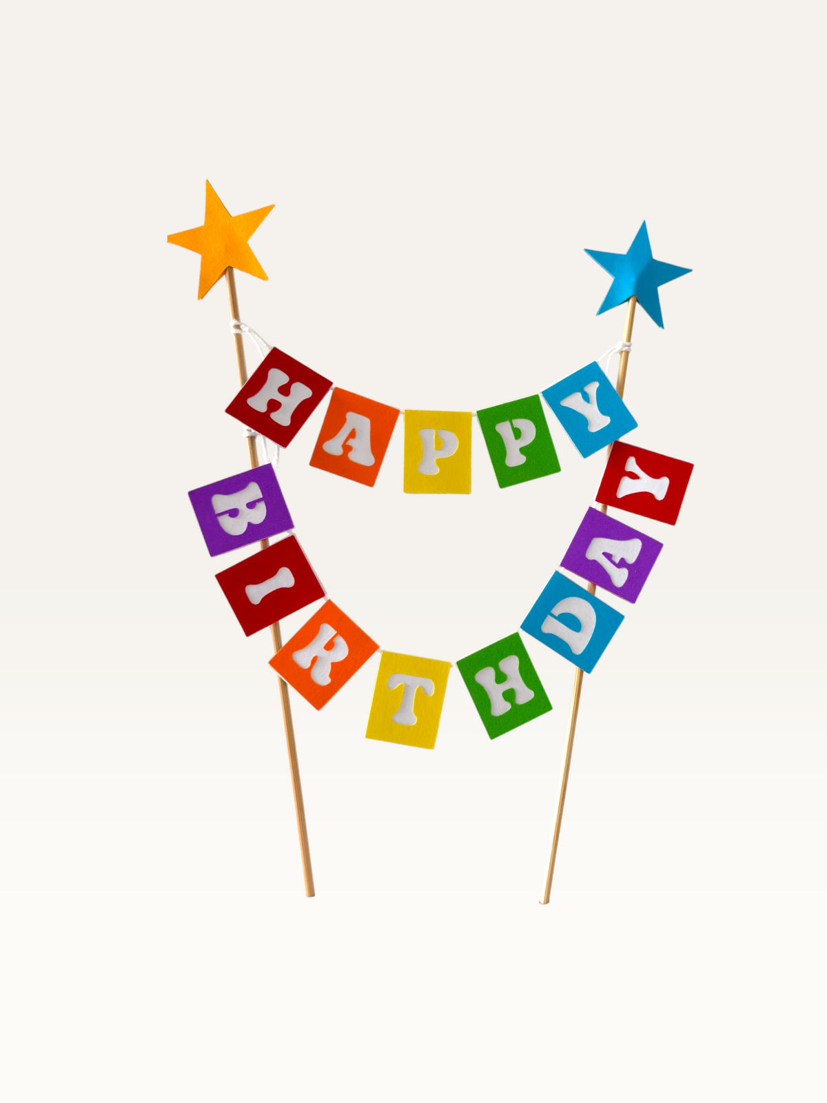 Paper Party Studio rainbow Happy Birthday bunting cake topper with foil star-tipped wooden picks.