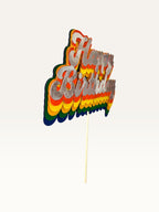 Paper Party Studio retro rainbow Happy Birthday cake topper with layered script lettering and silver top layer.