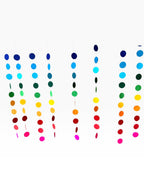 Paper Party Studio rainbow circle curtain backdrop with strands of blue, green, yellow, orange, red, and pink paper circles.