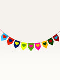 Paper Party Studio rainbow heart bunting made from layered cardstock for birthday and party decorations.