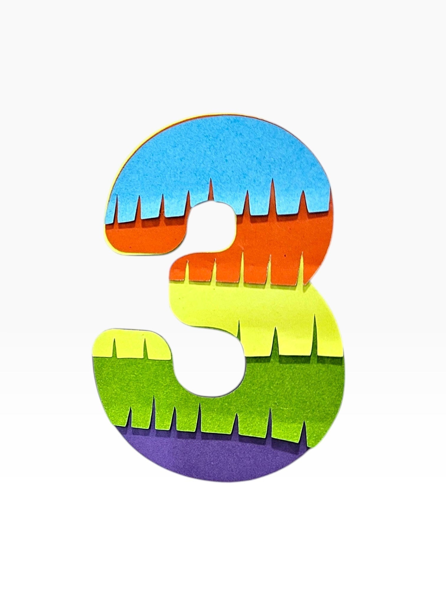 Paper Party Studio rainbow fringe number 3 cake topper, layered cardstock in blue, orange, yellow, green, and purple.