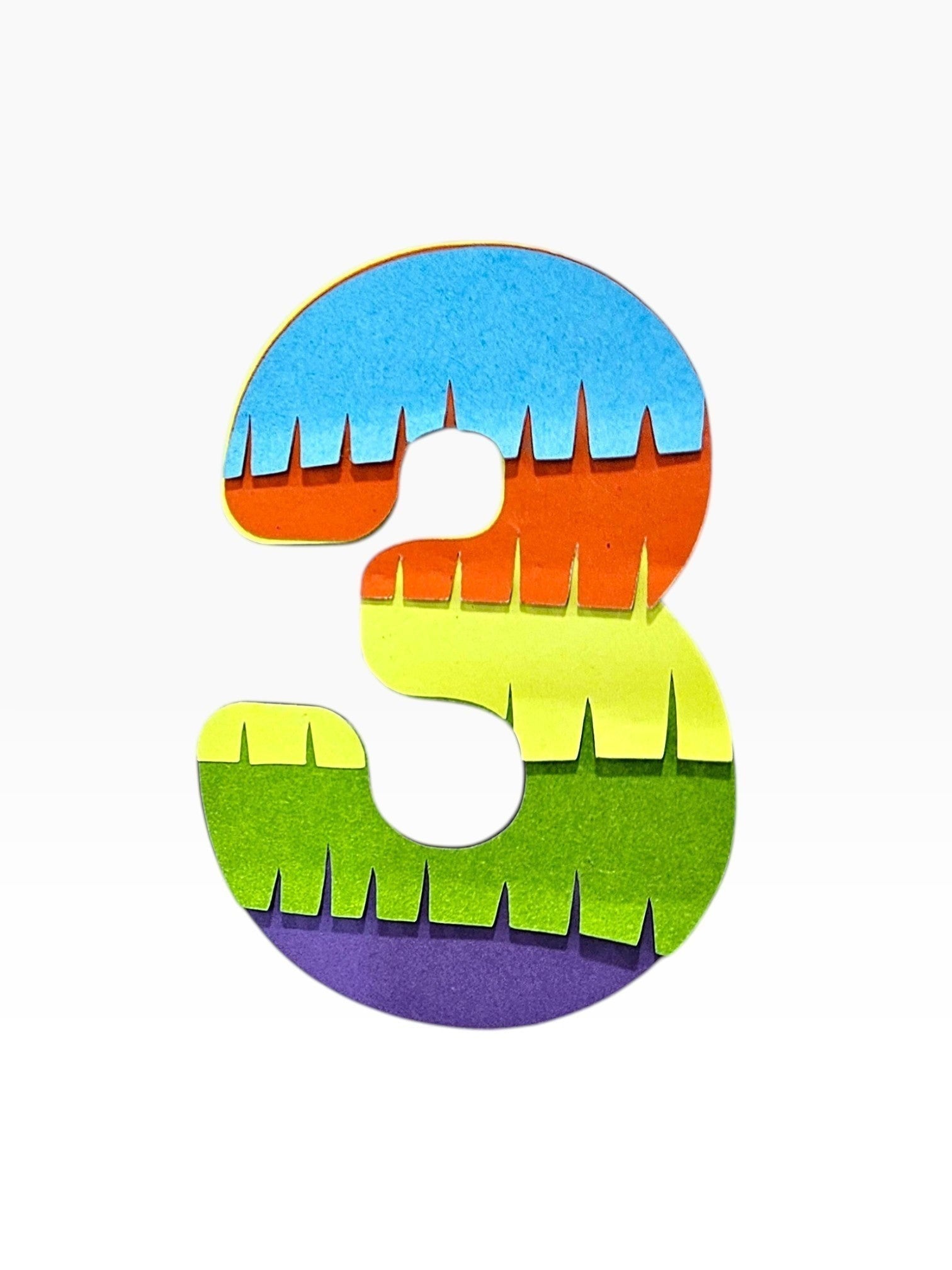 Paper Party Studio rainbow fringe number 3 cake topper, layered cardstock in blue, orange, yellow, green, and purple.