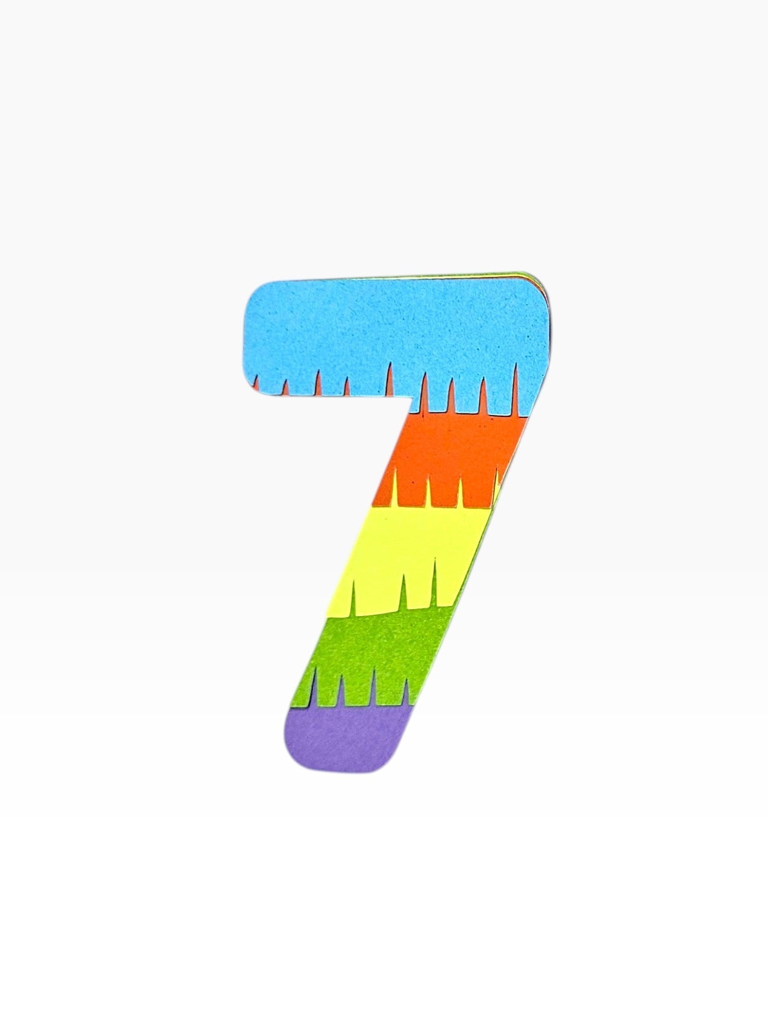 Paper Party Studio rainbow fringe number 7 cake topper, layered cardstock in blue, orange, yellow, green, and purple.