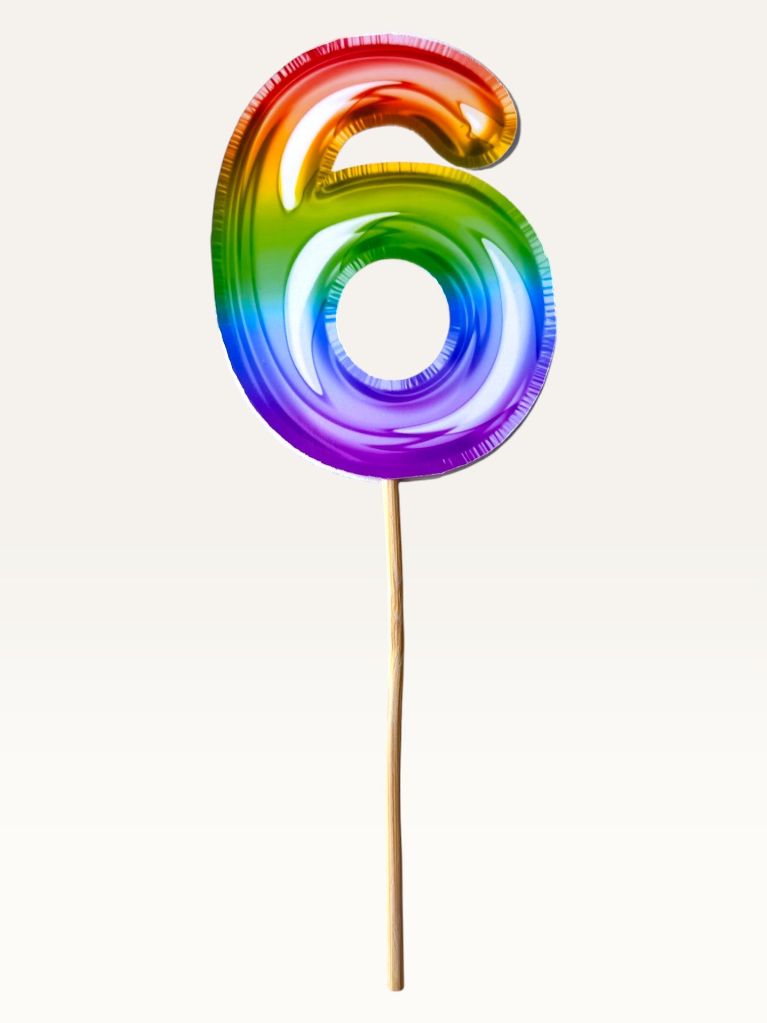 Paper Party Studio rainbow foil number 6 cake topper on a bamboo stick for birthday celebrations.