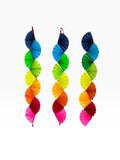 Paper Party Studio rainbow paper fan garland for party decorations, featuring vibrant cardstock folded wave design.