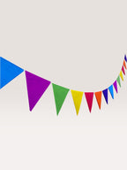 Paper Party Studio rainbow tissue paper pennant bunting with triangle flags, ready to hang.
