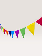 Paper Party Studio rainbow tissue paper pennant bunting with triangle flags, perfect for parties and celebrations.