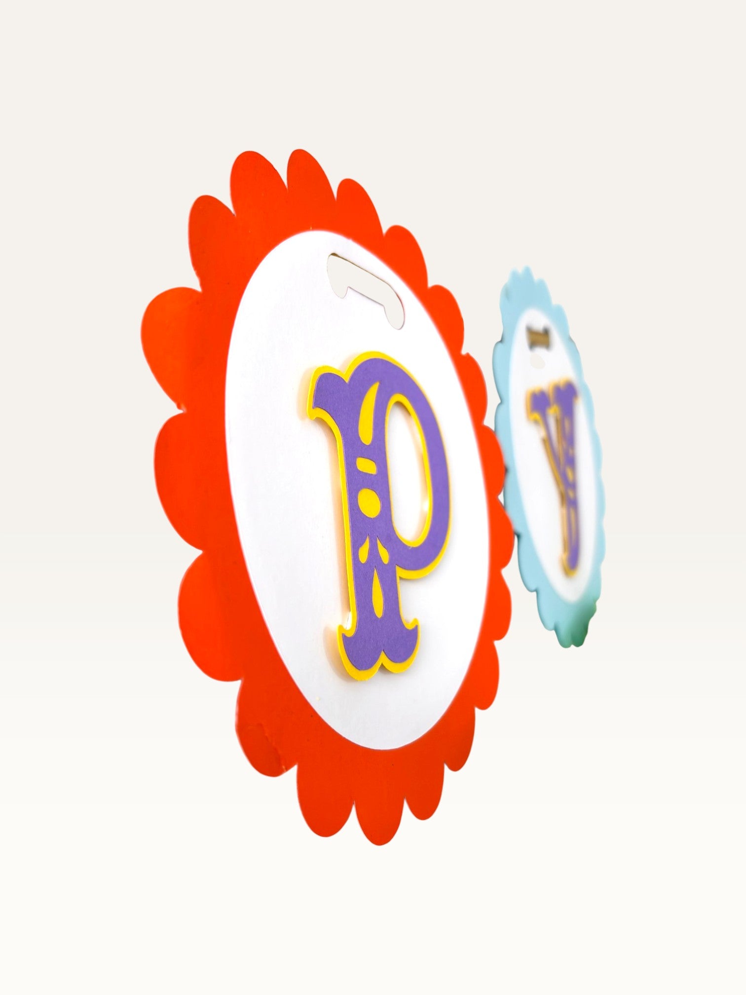Paper Party Studio Happy Birthday banner featuring scalloped rainbow cardstock circles with purple and gold lettering