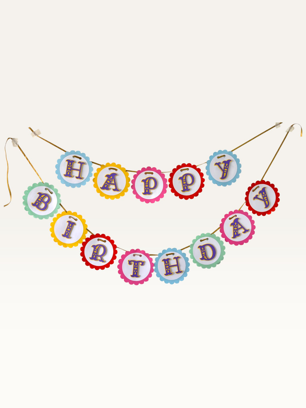 Paper Party Studio Happy Birthday banner with rainbow scalloped cardstock circles and purple and gold lettering.