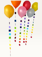 Paper Party Studio set of 10 rainbow square garland strings featuring colorful paper squares on fine hanging string.