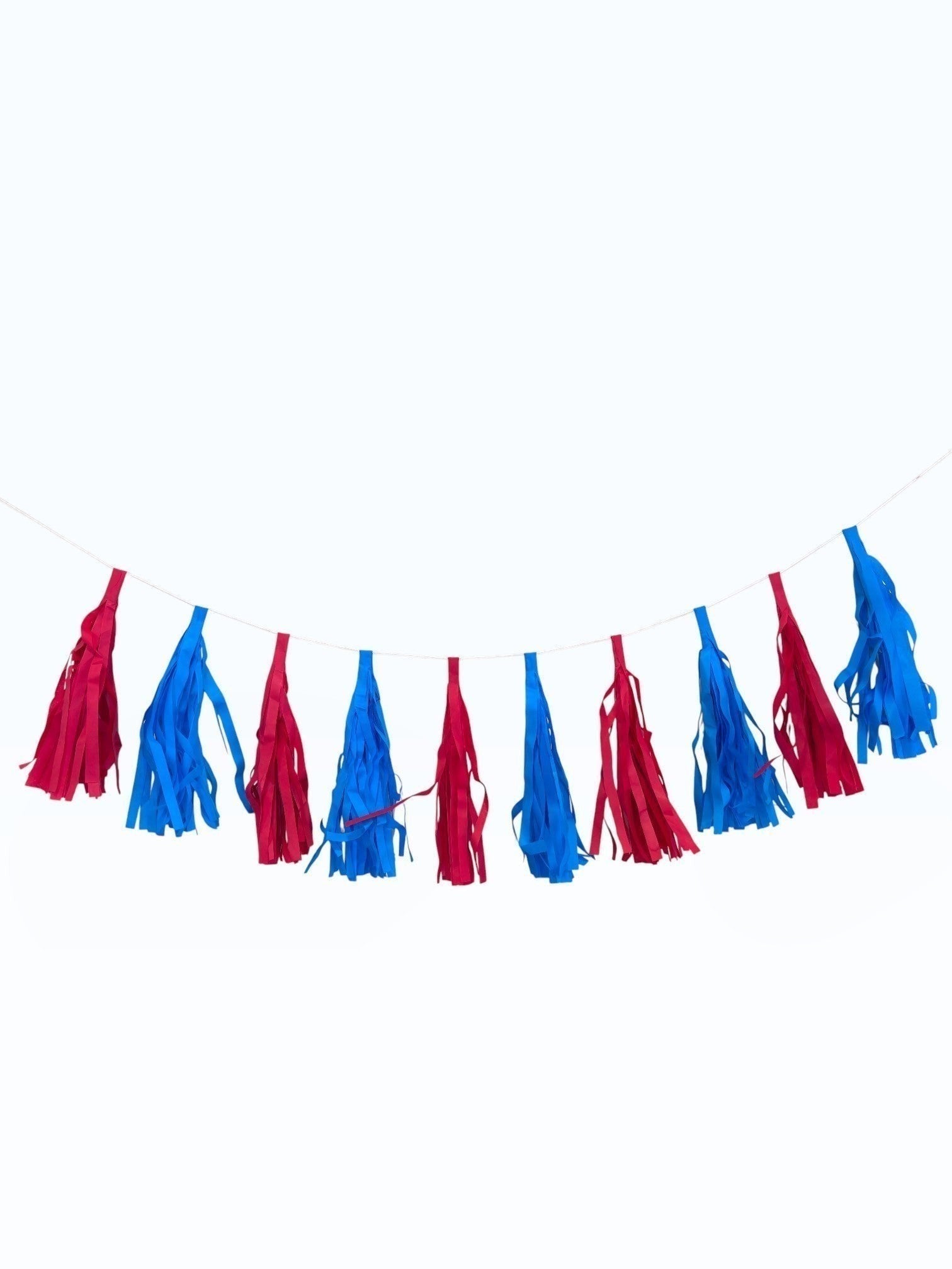 Paper Party Studio red and blue tissue paper tassel garland for party decorations and photo backdrops.