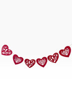 Paper Party Studio red heart bunting with floral cut-outs and "Love" script, perfect for Valentine's Day.