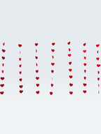 Paper Party Studio red heart garland, set of 10 strings with mini heart cut-outs, premium cardstock, reusable.